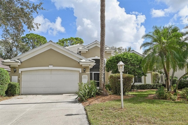 7217 Churston Ln, University Park, FL 34201 - view of front of property with concrete driveway, an attached garage, stucco siding, and a front yard