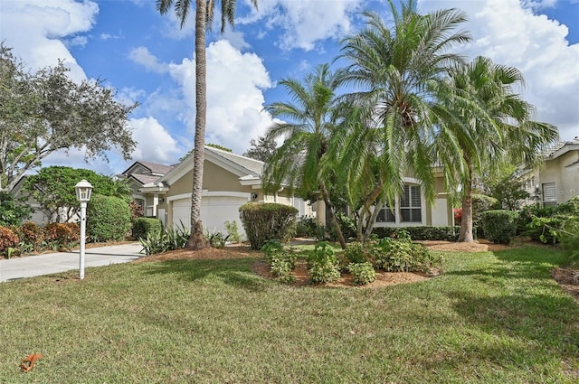 7217 Churston Ln, University Park, FL 34201 - obstructed view of property featuring stucco siding, an attached garage, driveway, and a front lawn