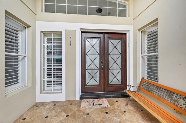 view of exterior entry featuring french doors