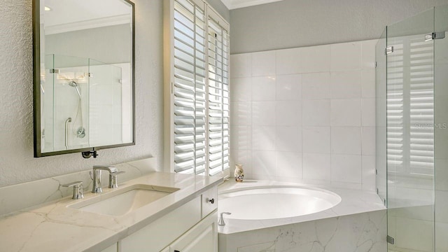 bathroom featuring vanity, crown molding, and plus walk in shower