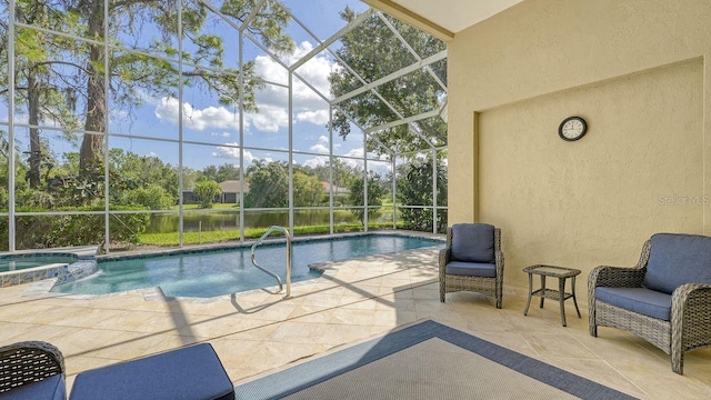 view of swimming pool featuring a patio area, an in ground hot tub, and glass enclosure