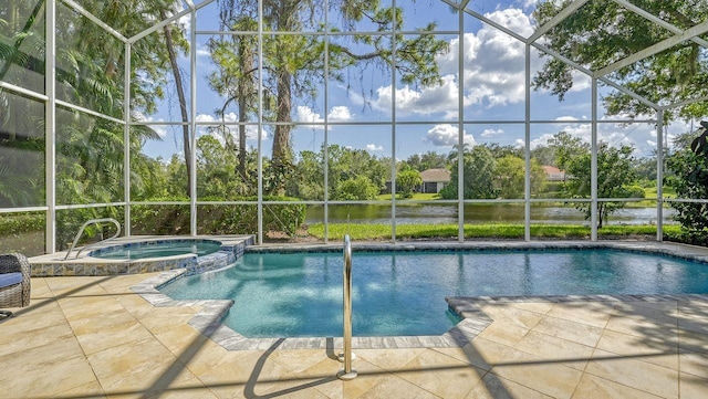 view of pool featuring an in ground hot tub, a water view, glass enclosure, and a patio area