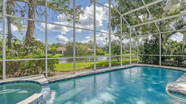 view of pool with an in ground hot tub and a lanai