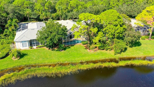 birds eye view of property with a water view