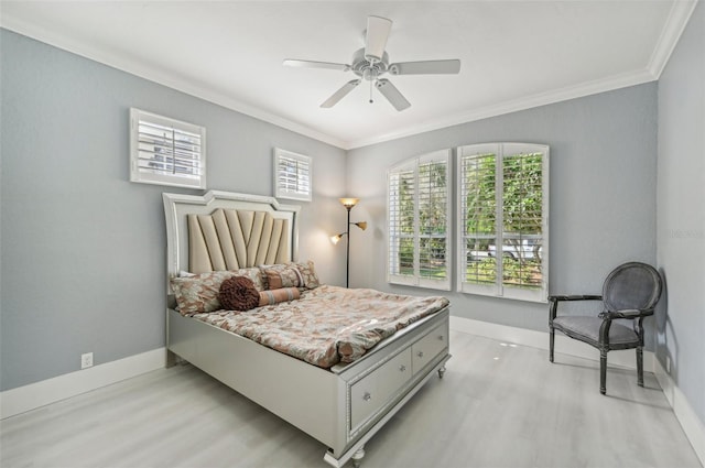 bedroom with crown molding, ceiling fan, and light wood-type flooring