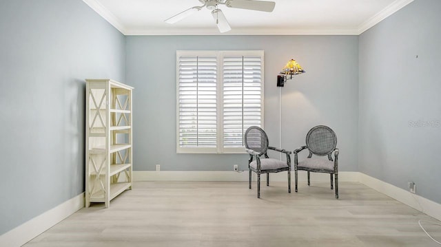 living area with ceiling fan, ornamental molding, and light wood-type flooring