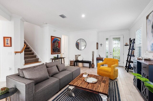 living room featuring crown molding and light wood-type flooring