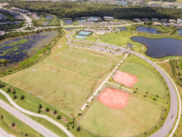 birds eye view of property with a water view