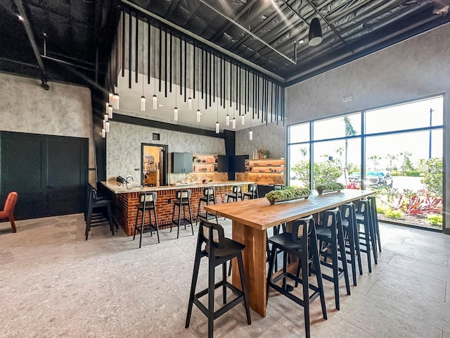 dining area with a high ceiling