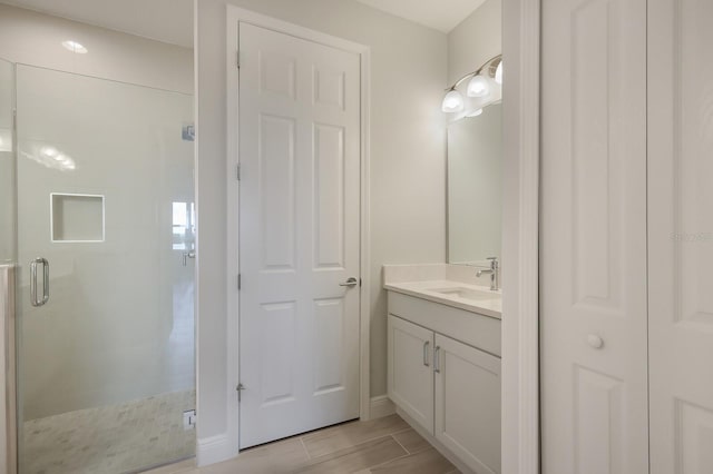 bathroom featuring vanity and walk in shower