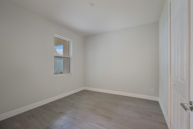 unfurnished room with light hardwood / wood-style floors