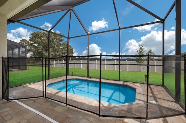 view of swimming pool featuring a patio, glass enclosure, and a lawn