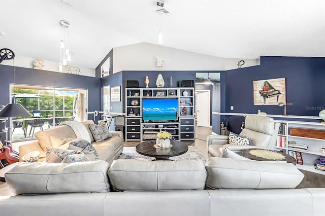 living room with lofted ceiling and hardwood / wood-style floors