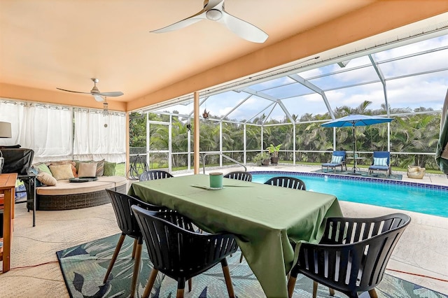 view of pool with ceiling fan, a patio, and a lanai