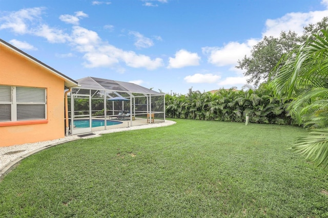 view of yard featuring glass enclosure