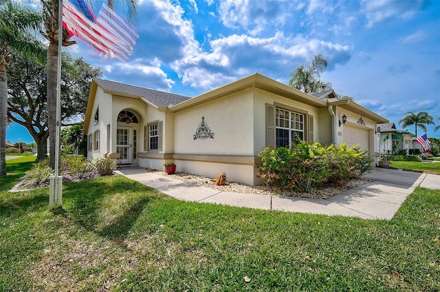 view of front facade featuring a front lawn and a garage