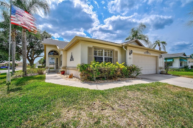 view of front of home featuring a front yard and a garage