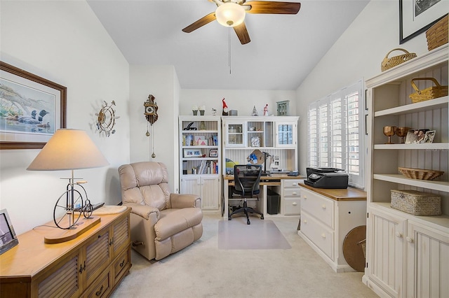 carpeted office with ceiling fan and lofted ceiling