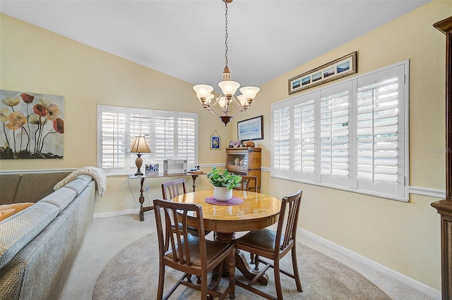 dining area featuring light colored carpet, lofted ceiling, and a chandelier