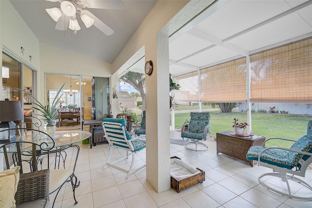 sunroom / solarium with ceiling fan and lofted ceiling