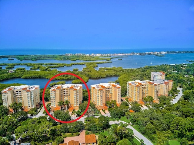 birds eye view of property with a water view