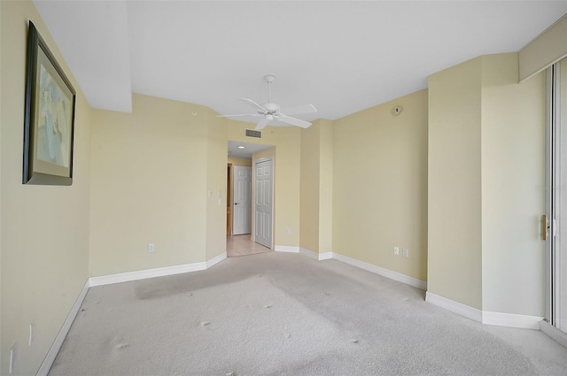 spare room with light carpet and ceiling fan