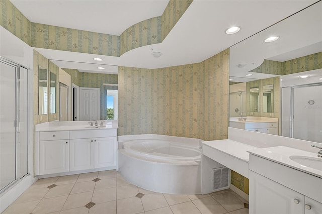 bathroom featuring tile patterned floors, plus walk in shower, and vanity