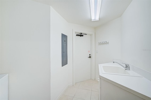 bathroom with vanity, electric panel, and tile patterned flooring