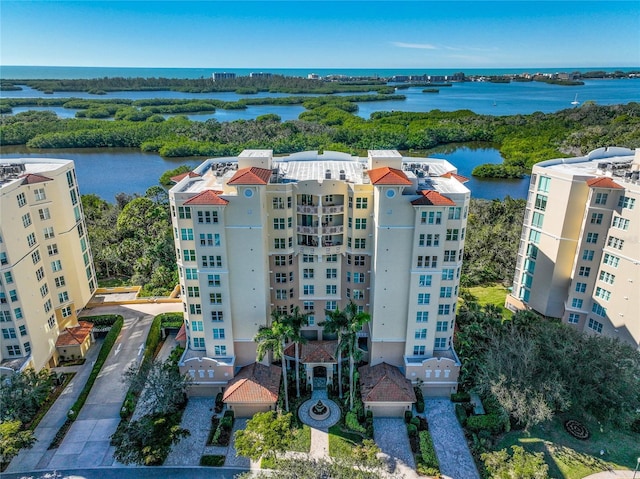 birds eye view of property with a water view