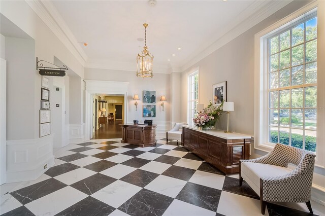 interior space featuring dark tile patterned flooring, ornamental molding, and an inviting chandelier