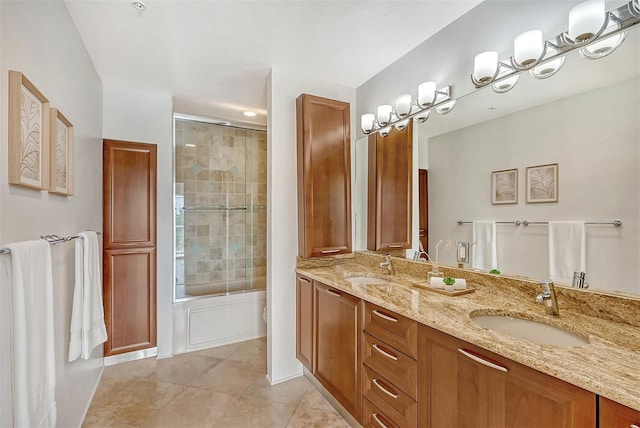 full bathroom featuring toilet, vanity, shower / bath combination with glass door, and tile patterned flooring