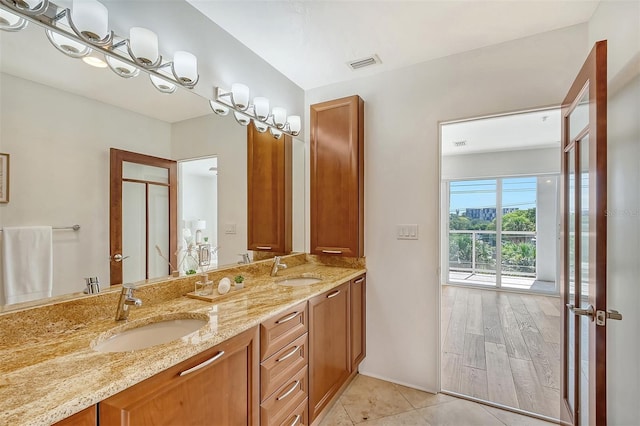 bathroom with tile patterned floors and vanity