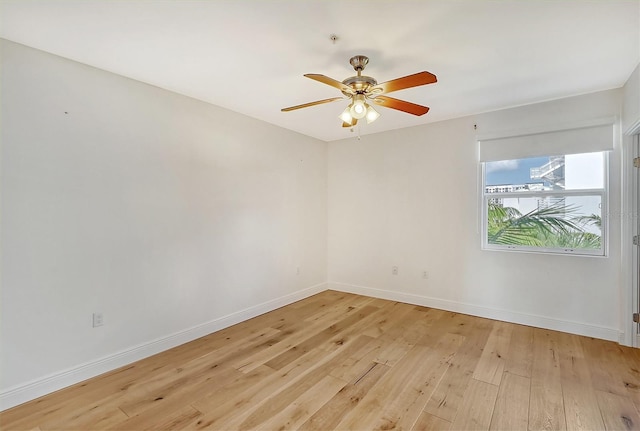 spare room featuring ceiling fan and light wood-type flooring