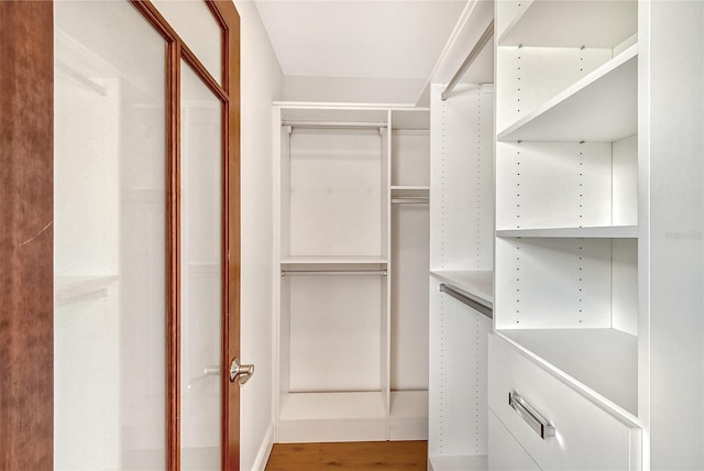 spacious closet featuring hardwood / wood-style floors