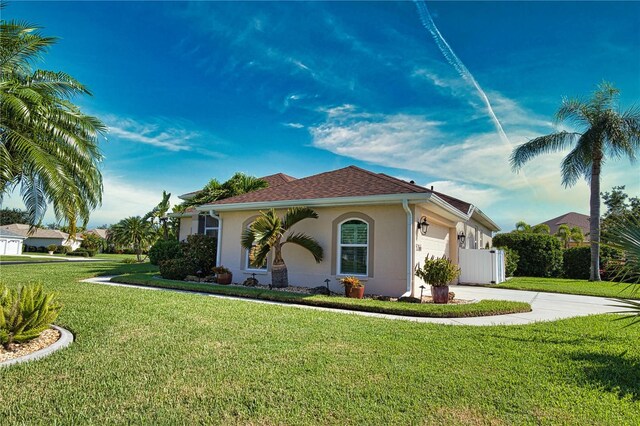 mediterranean / spanish-style house with a front yard