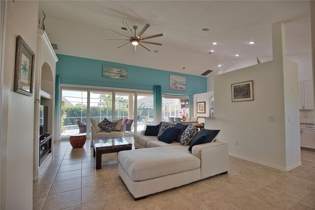 living room with ceiling fan, high vaulted ceiling, and light tile patterned flooring