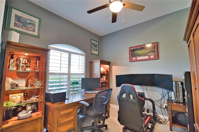 office area with ceiling fan and light hardwood / wood-style floors