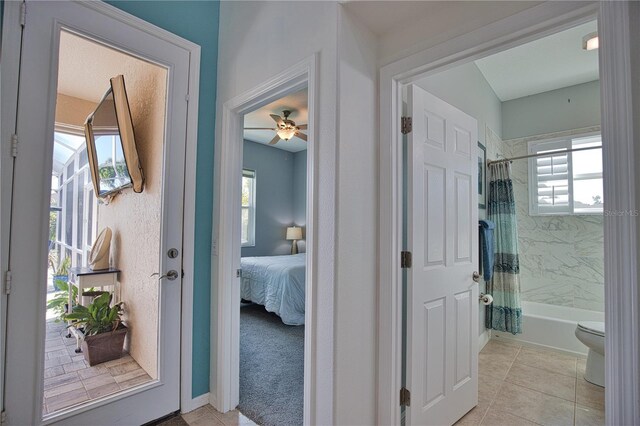 interior space featuring light tile patterned floors and a wealth of natural light