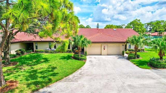 view of front facade featuring a front yard and a garage