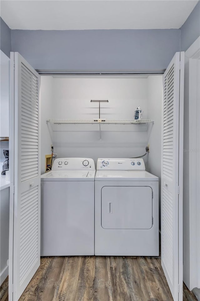 laundry area featuring hardwood / wood-style flooring and independent washer and dryer