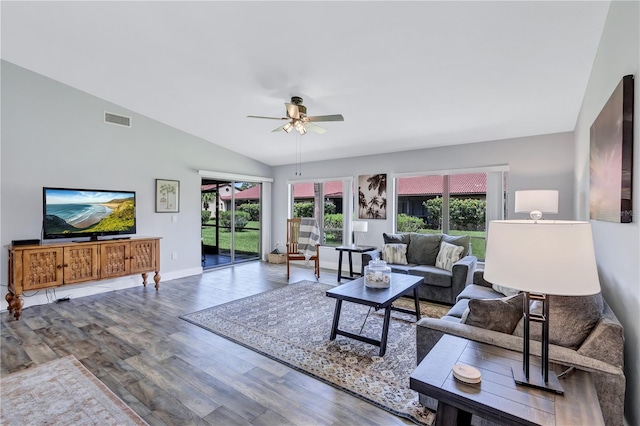 living room featuring ceiling fan, vaulted ceiling, and hardwood / wood-style floors