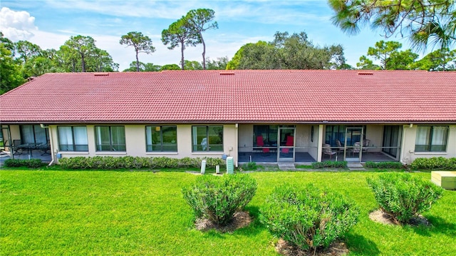 single story home with a patio and a front yard