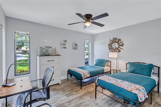 bedroom featuring ceiling fan and light wood-type flooring