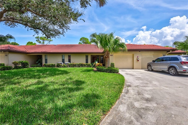 ranch-style house with a garage and a front lawn