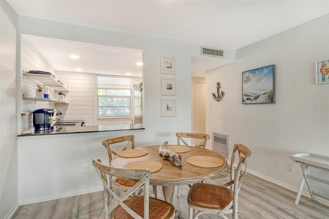 dining space featuring light hardwood / wood-style flooring