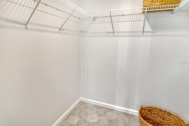 walk in closet featuring tile patterned flooring