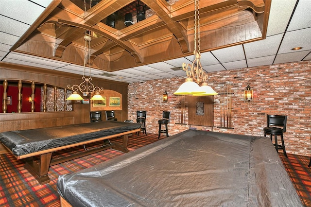 game room featuring billiards, brick wall, and a paneled ceiling