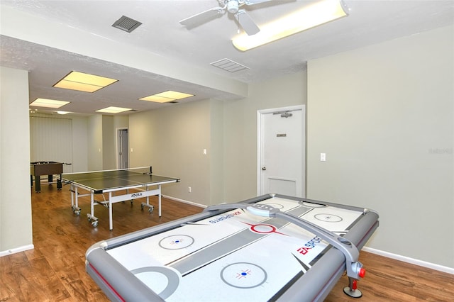 playroom with ceiling fan, wood-type flooring, and a textured ceiling