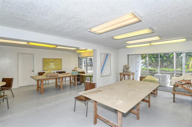 dining room featuring a textured ceiling