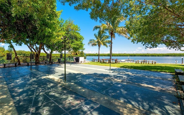 view of sport court featuring a water view